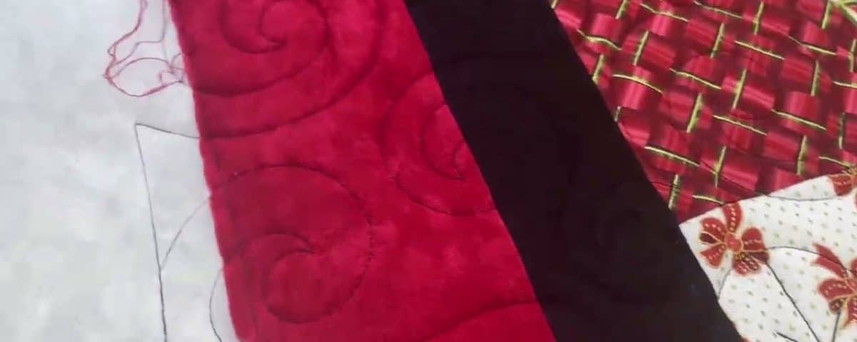 Cathie’s “Double Slice Christmas” quilt - Longarm quilted by Maynard Longarm Quilting