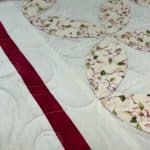 Cathie’s “Apple Blossom Pumpkin seed” quilt - Longarm quilted by Maynard Longarm Quilting