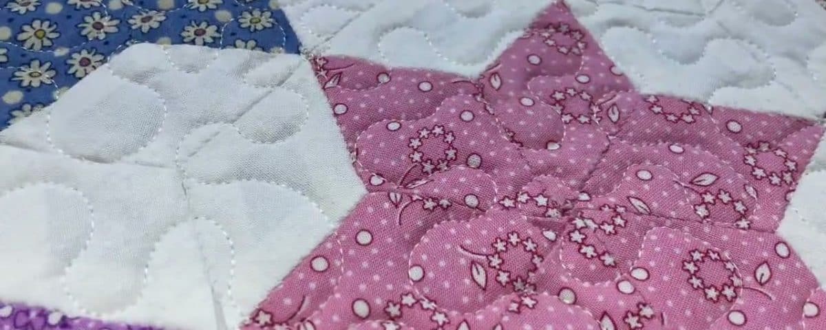 Cathie’s “HEXY Stars” quilt - Longarm quilted by Maynard Longarm Quilting