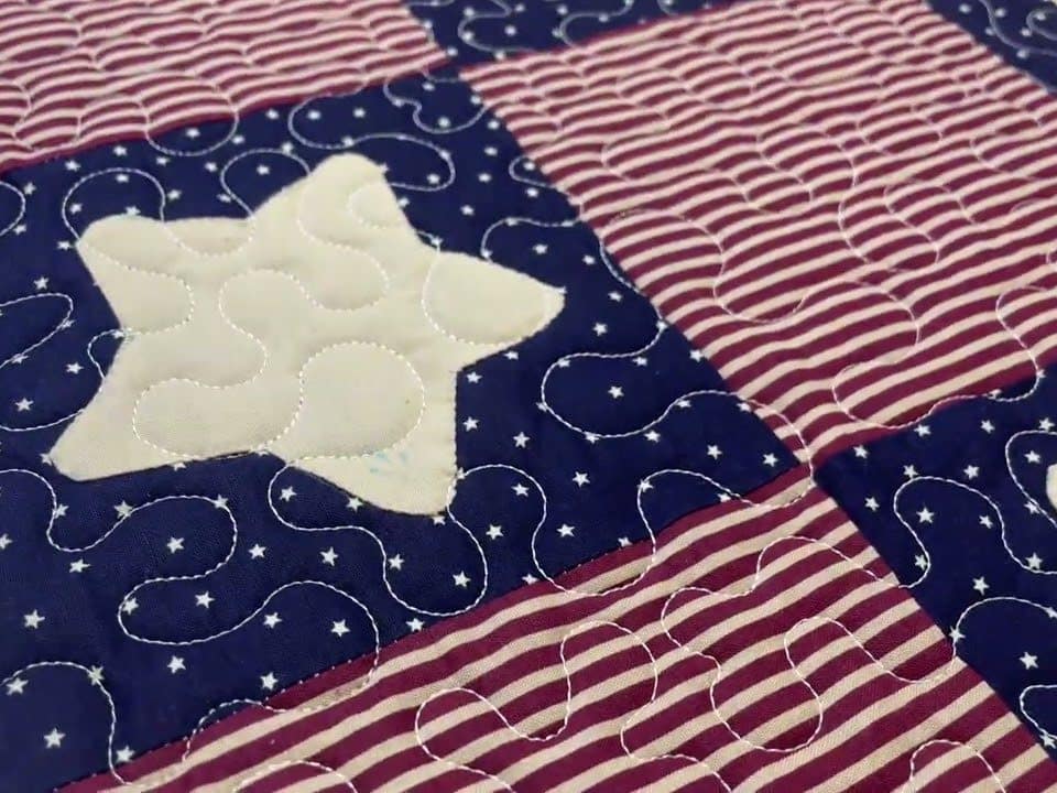 Cathie’s “Appliquéd Stars” quilt - Longarm quilted by Maynard Longarm Quilting