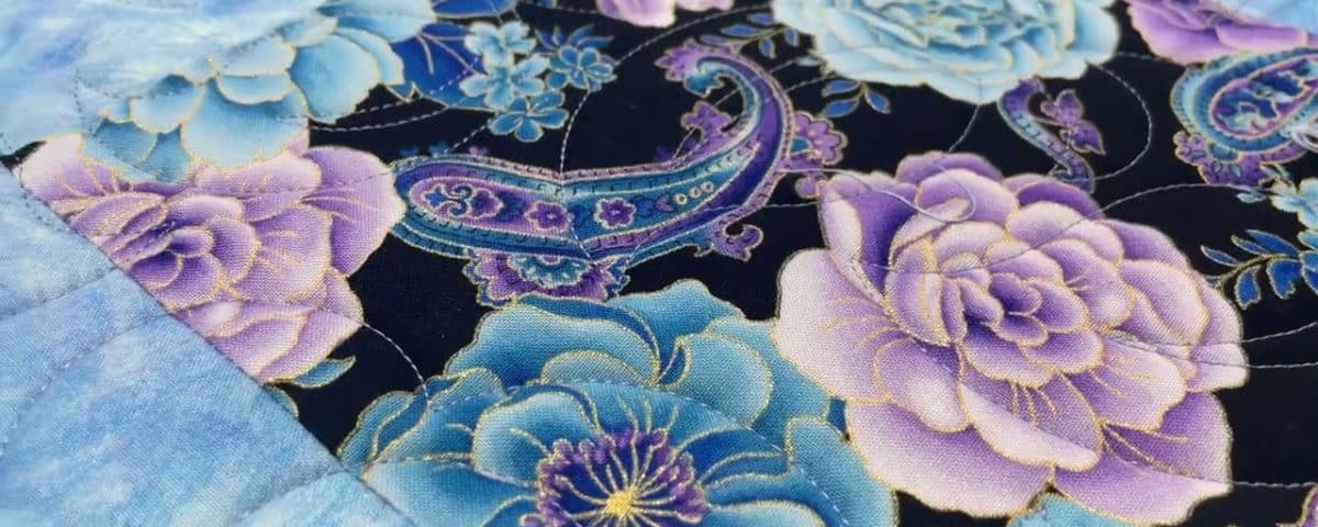 Loriann’s “Purple Flowers” quilt - Longarm quilted by Maynard Longarm Quilting
