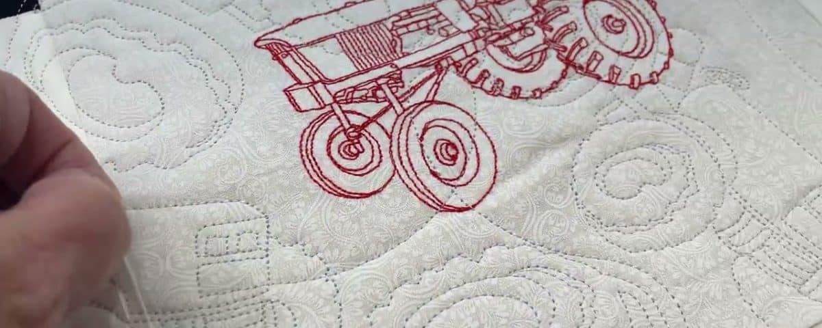 Gloria’s “Tractor” quilt - Longarm quilted by Maynard Longarm Quilting