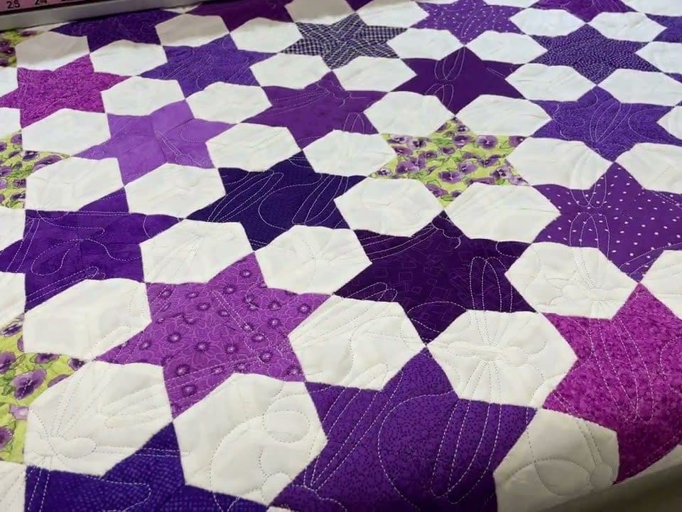 Cathie’s “Possessed Stars” quilt - Longarm quilted by Maynard Longarm Quilting