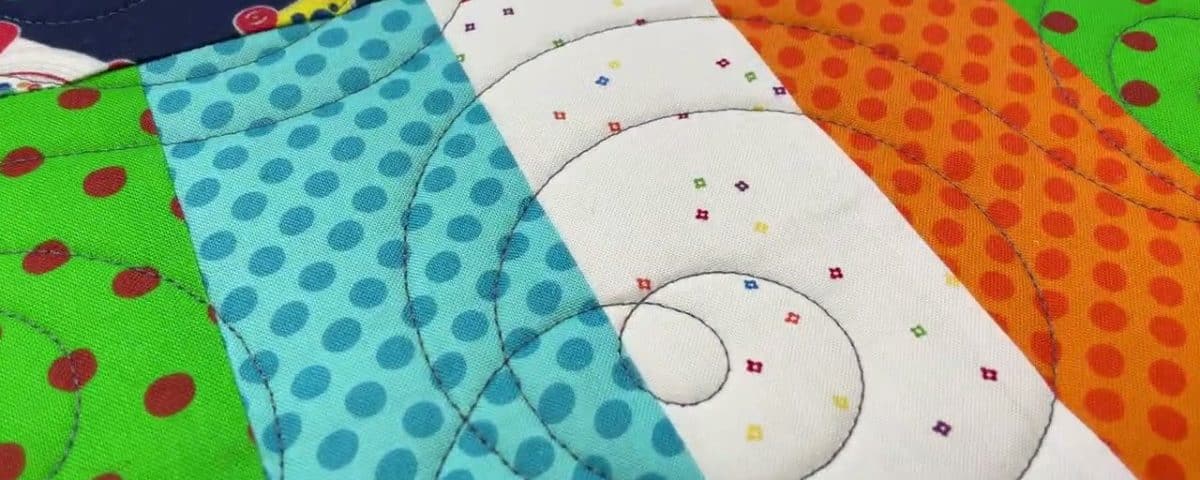 Leslie’s “Fisher Price” kid’s quilt - Longarm quilted by Maynard Longarm Quilting