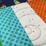 Leslie’s “Fisher Price” kid’s quilt - Longarm quilted by Maynard Longarm Quilting