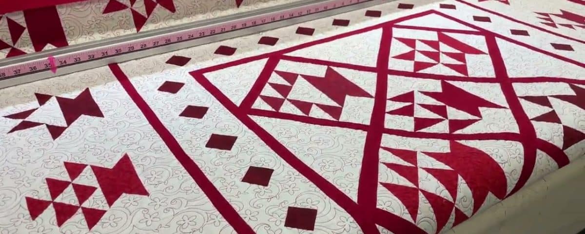 Carol B’s “Red Baskets” quilt - Longarm quilted by Maynard Longarm Quilting